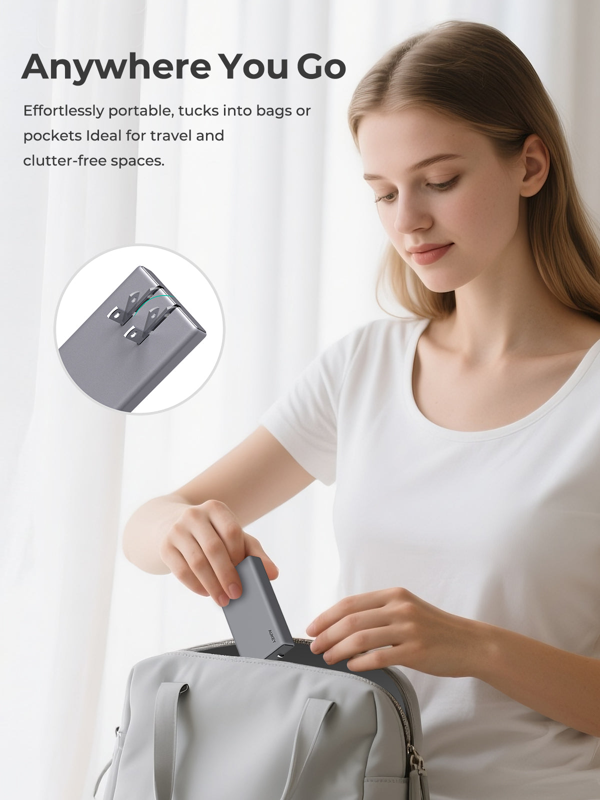 AUKEY Comet Slim 67W PD Wall Charger being placed in a bag by a woman for portable travel use